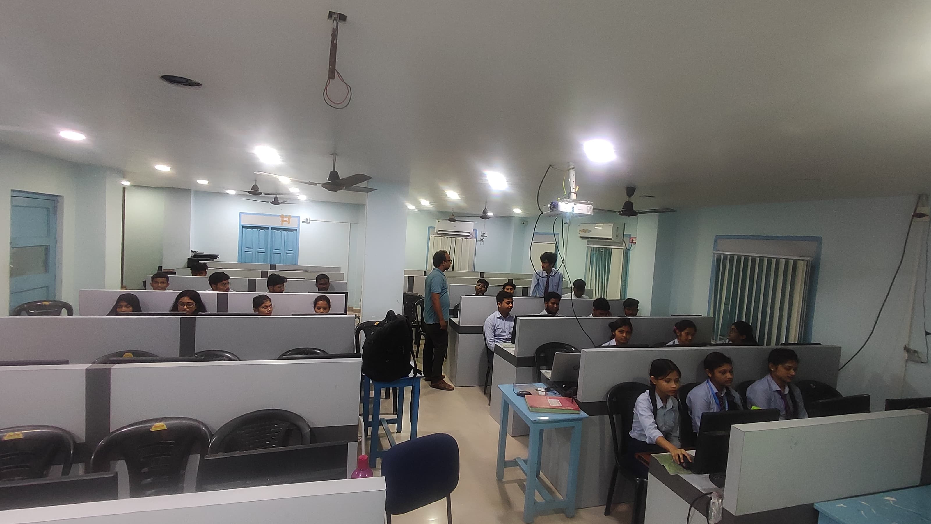 Students seated in a computer lab training room